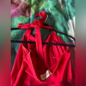 Belle Poque red size small Mid length dress with a back slit.